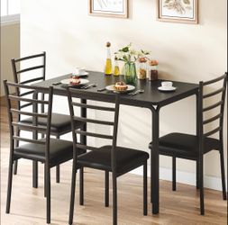 Brand-new table and four chairs (still in the box) -