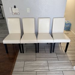 BRAND NEW!!! 4 White Faux Leather Dining Chairs