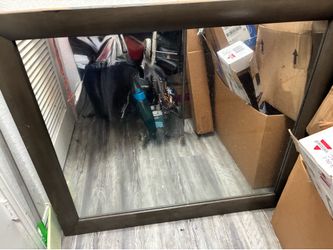 Large mirror w brown wooden boarder