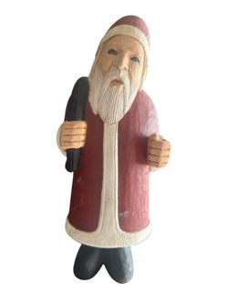Christmas hand-carved wooden Santa Claus, a piece of folk art that is a popular style of Christmas decoration and collectible item. The style often fe