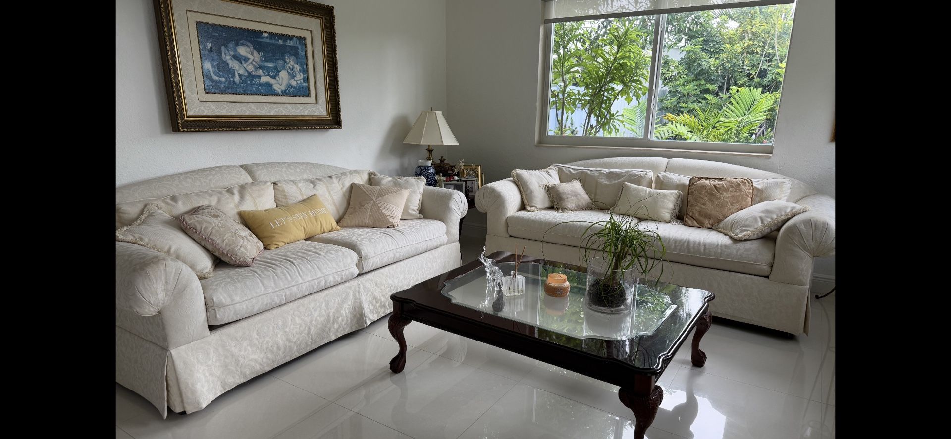 A Set Of sofas With End Table And Coffee Table