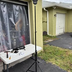 iPhone Holder With A Tripod That Extends 