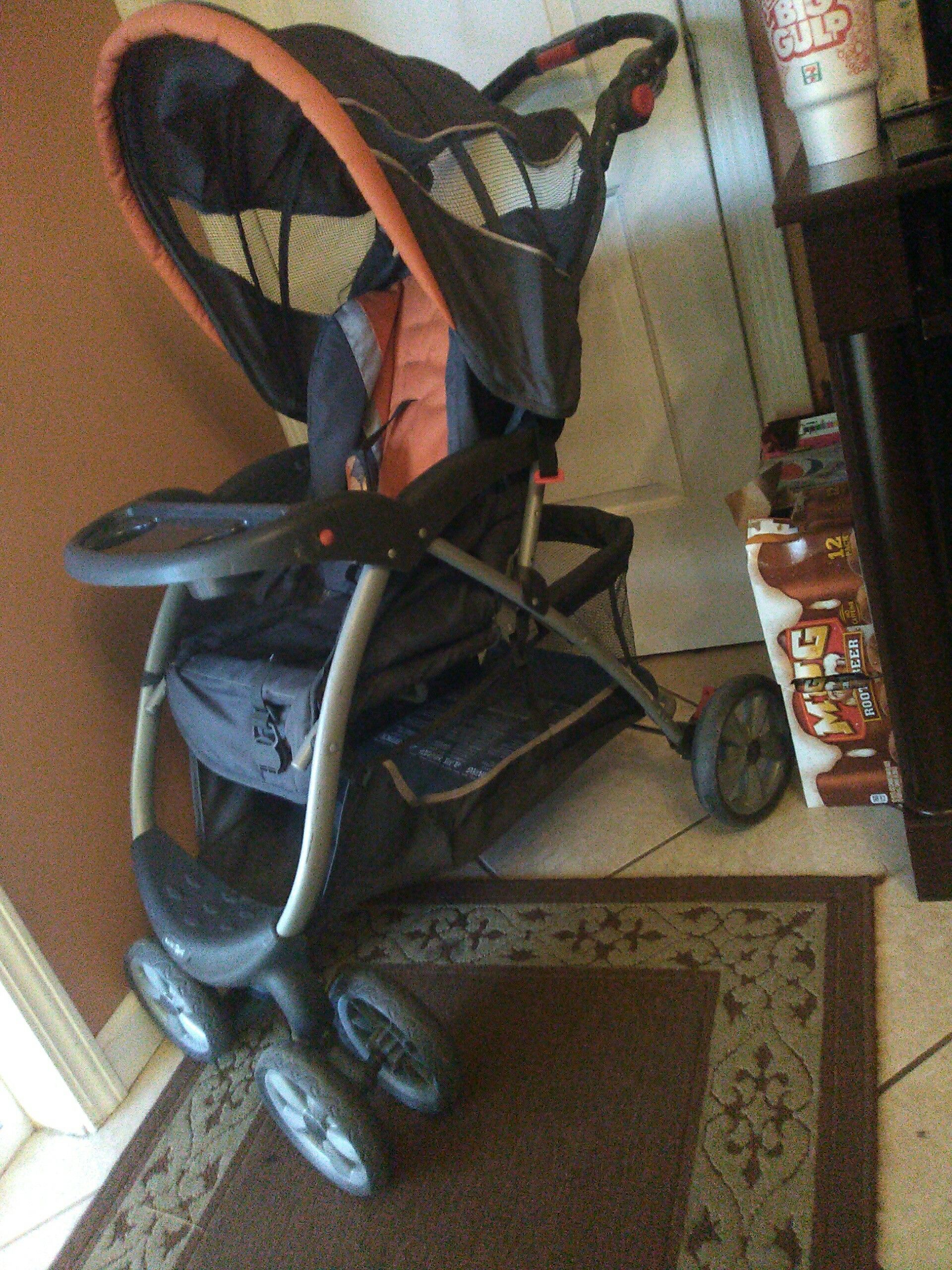 Orange & grey Babies-R-Us stroller