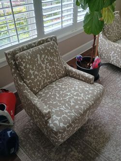 2x upholstered swivel chairs