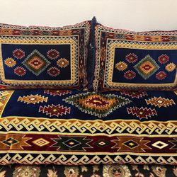 Fourteen pillows with seven mattresses