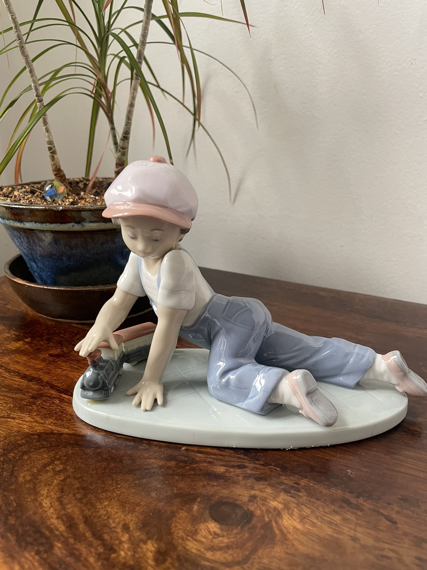 Lladro Porcelain Figurine “Boy Playing With Train”
