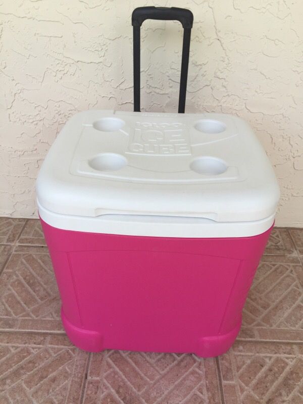 Pink igloo ice cube cooler with wheels