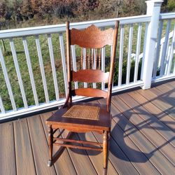 Antique Carved Oak Pressed Back Cane Seat Rocking Chair