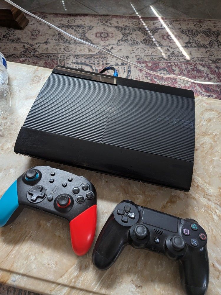 PS3 With Controllers And Couple Games