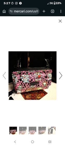 Brand New Ed Hardy trifold wallet featuring a pink leopard print with tattoo-style skull graphics