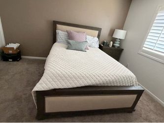 Living spaces, queen, size bed, and two side tables
