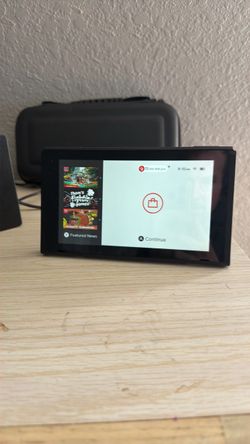 Nintendo Switch with 10 games (joycons broken)
