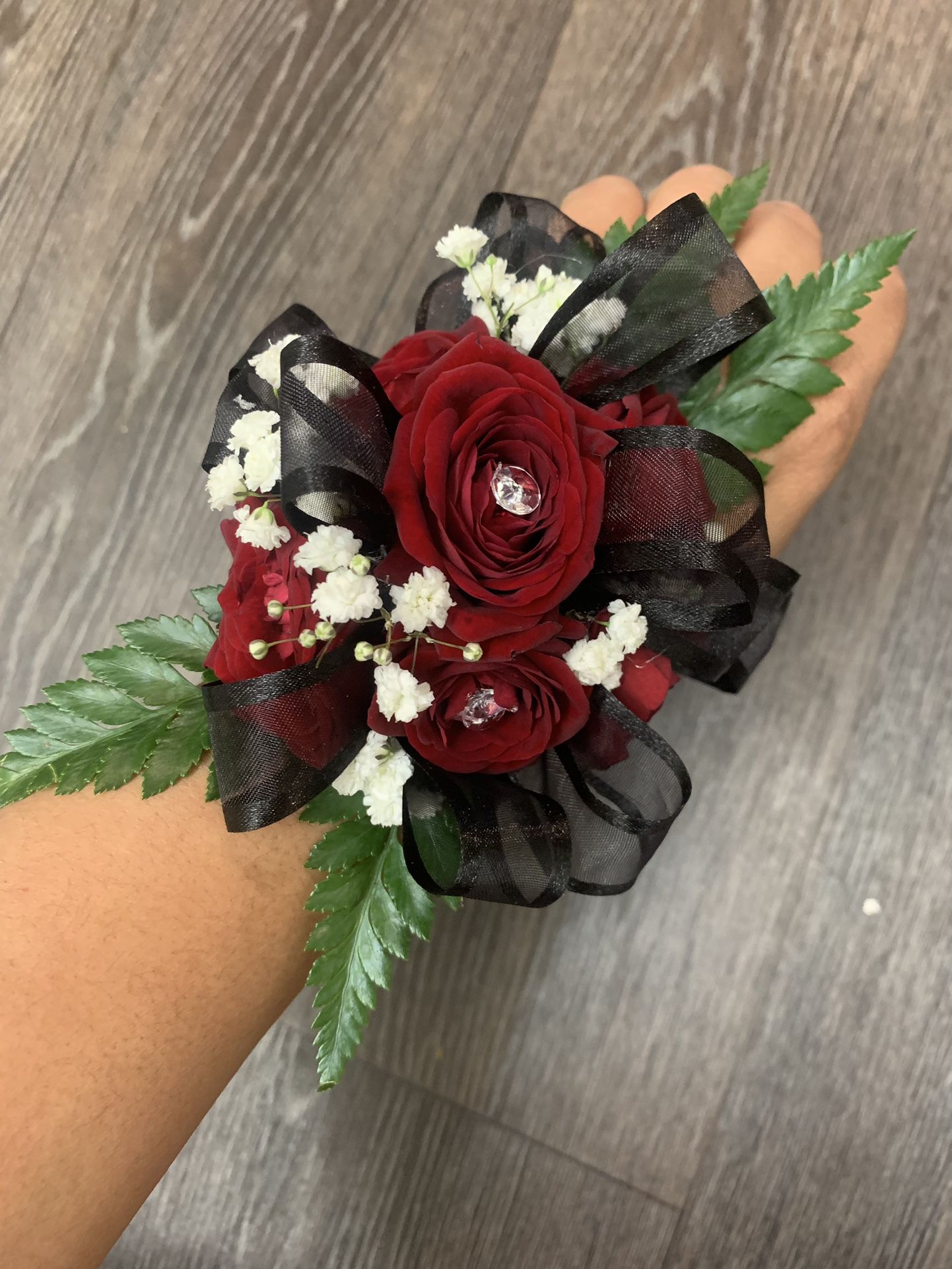 Red And Black Corsage Available 