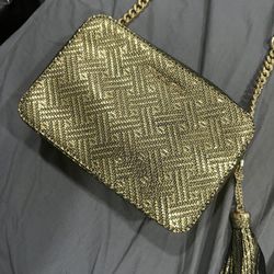 Michael Kors Ginny medium camera bag in metallic gold-tone leather with a herringbone pattern and chain-link accents