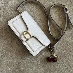 coach purse with cherry charm 