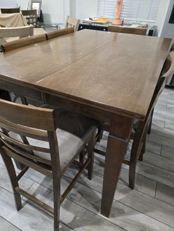 Wooden Dining room table with 6 chairs