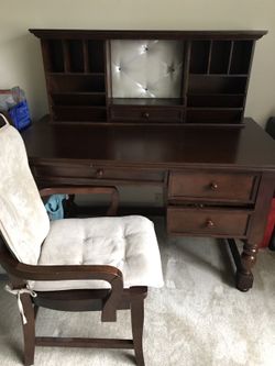 Brown wooden desk with hutch and chair