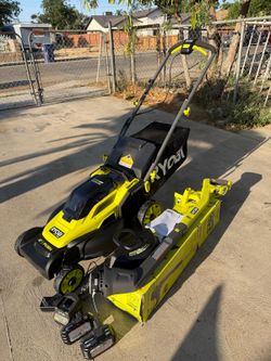 RYOBI 18V Lawn Mower Kit: 16-inch Lawn Mower and Trimmer, (1) 4Ah Battery, (1) 2Ah Battery, and (1) Charger.