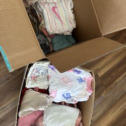 2 boxes of baby clothes 