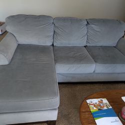 Light blue couch with ottoman