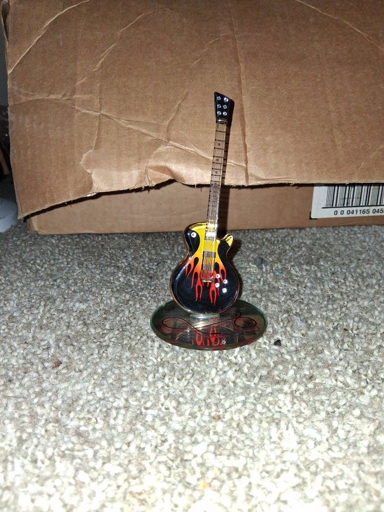 Glass Baron Smokin' Hot Guitar" figurine.