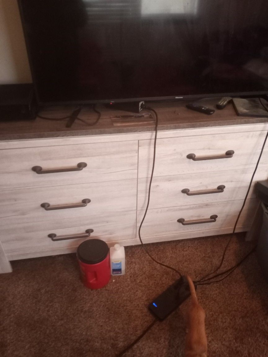 A Dresser That Has Six Drawers