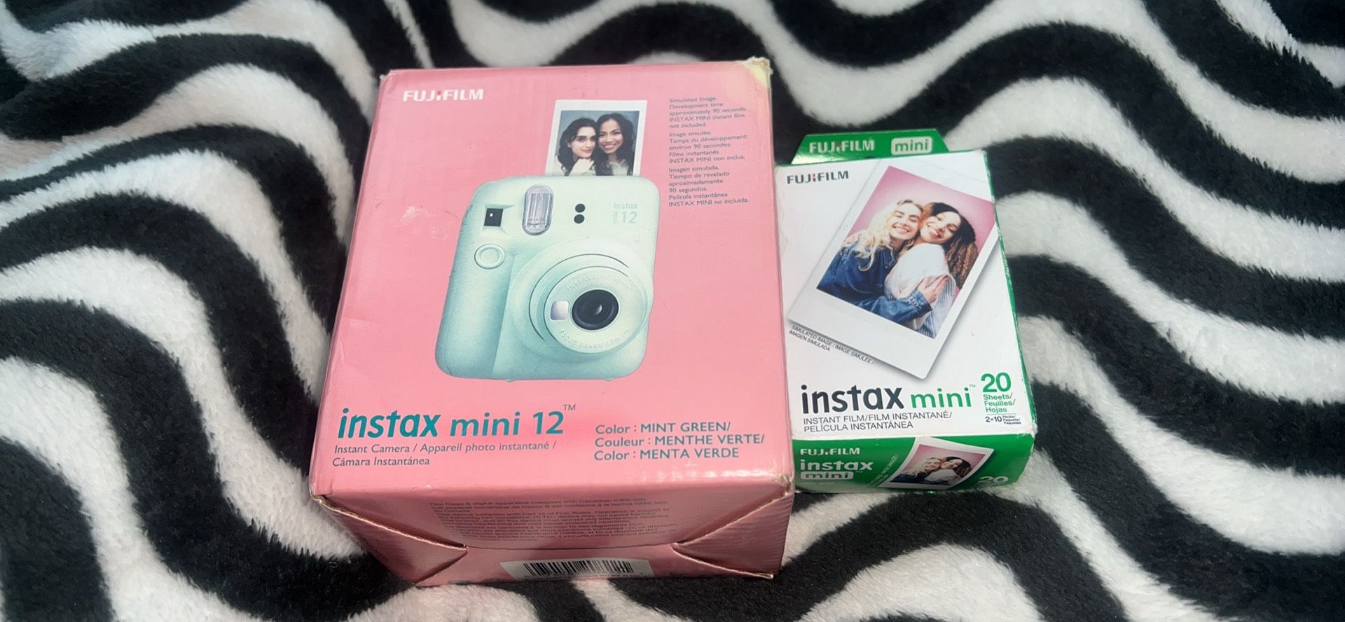 Instamax mini 12 Polaroid with film/ Cannon EOS 400D with lens