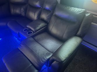 Brown leather sectional with built in lights