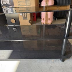 BLACK GLASS TV STAND IN GREAT CONDITION