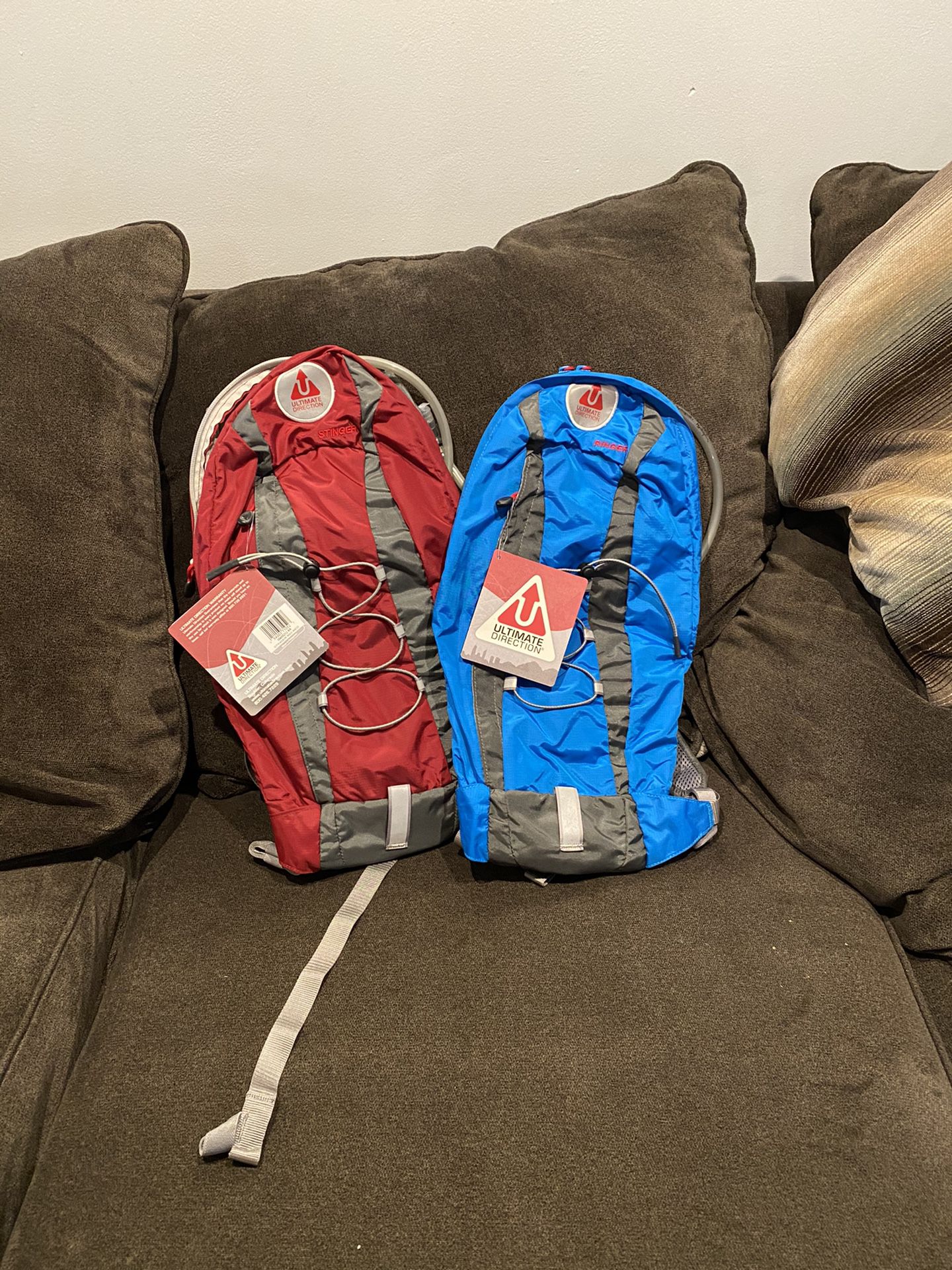 Ultimate Direction Stinger Hydration Pack red/ blue $45 each