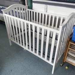 54”L, White crib There is slight wear on the paint,  can be seen in one of the pictures.