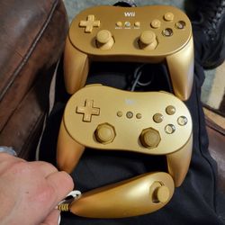 rare Gold Nintendo wii pro controllers 50.00 each
 and Gold nunchuck Sold