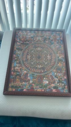 Framed Tibetan Buddhist Mandala Thangka painting with intricate figures.