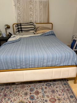 Gold metal bed frame and a tempur pedic mattress