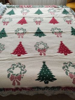 Large heavy lap blanket. Across a queen bed so pretty big. Small coffee stain as shown in last pic. Had also been used as a table cloth