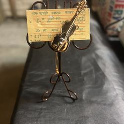 gold-colored music stand and violin ornament