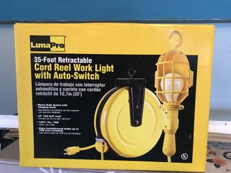 Cord reel work light with auto switch-Reduced