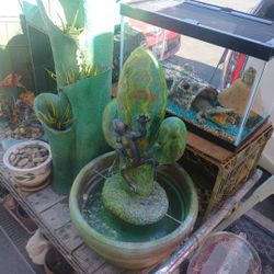 2 Feet Tall Terrcecota  Pot On Bottom  Top Part Is Fiberglass 