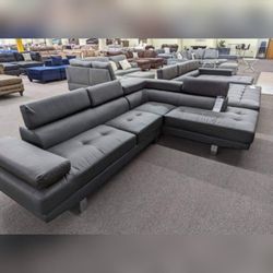 Black faux leather livingroom sectional couch