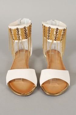 White flats with gold accents and beaded details