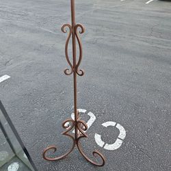 Single wrought iron candle stand