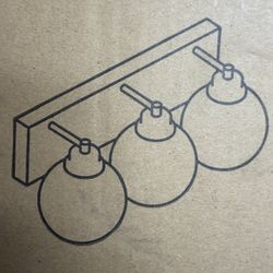 New gold three light vanity with 6 inch clear round glass shades.