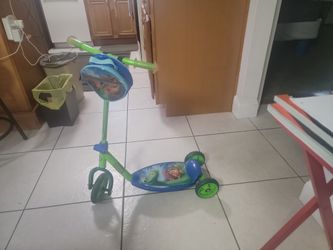 Green & Blue Three Wheel Scooter. 