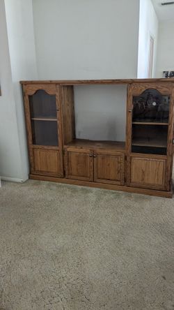 Entertainment Center With Glass Doors That Lights Up And Has Wheels