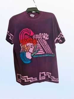 Purple and pink graphic tee with Aztec design