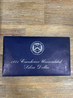 1971 U.S. Mint Eisenhower Uncirculated Silver Dollar held in its original "Blue Ike" packaging