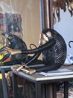 Hanging metal monkey tealight holder