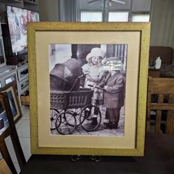 Vintage Nostalgic Look Wooden Frame Matted With Sepia Photo Print, Children Pushing A Baby Carriage & Smiling At Each Other 24.5" X 21.5"