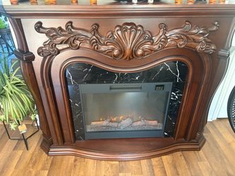 Electric Fireplace with Ornate Wood Mantel