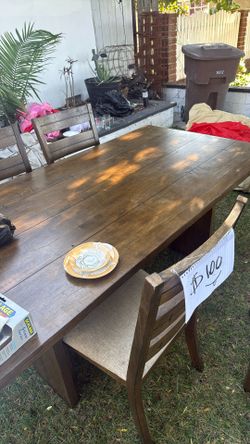 wood table w/ four chairs